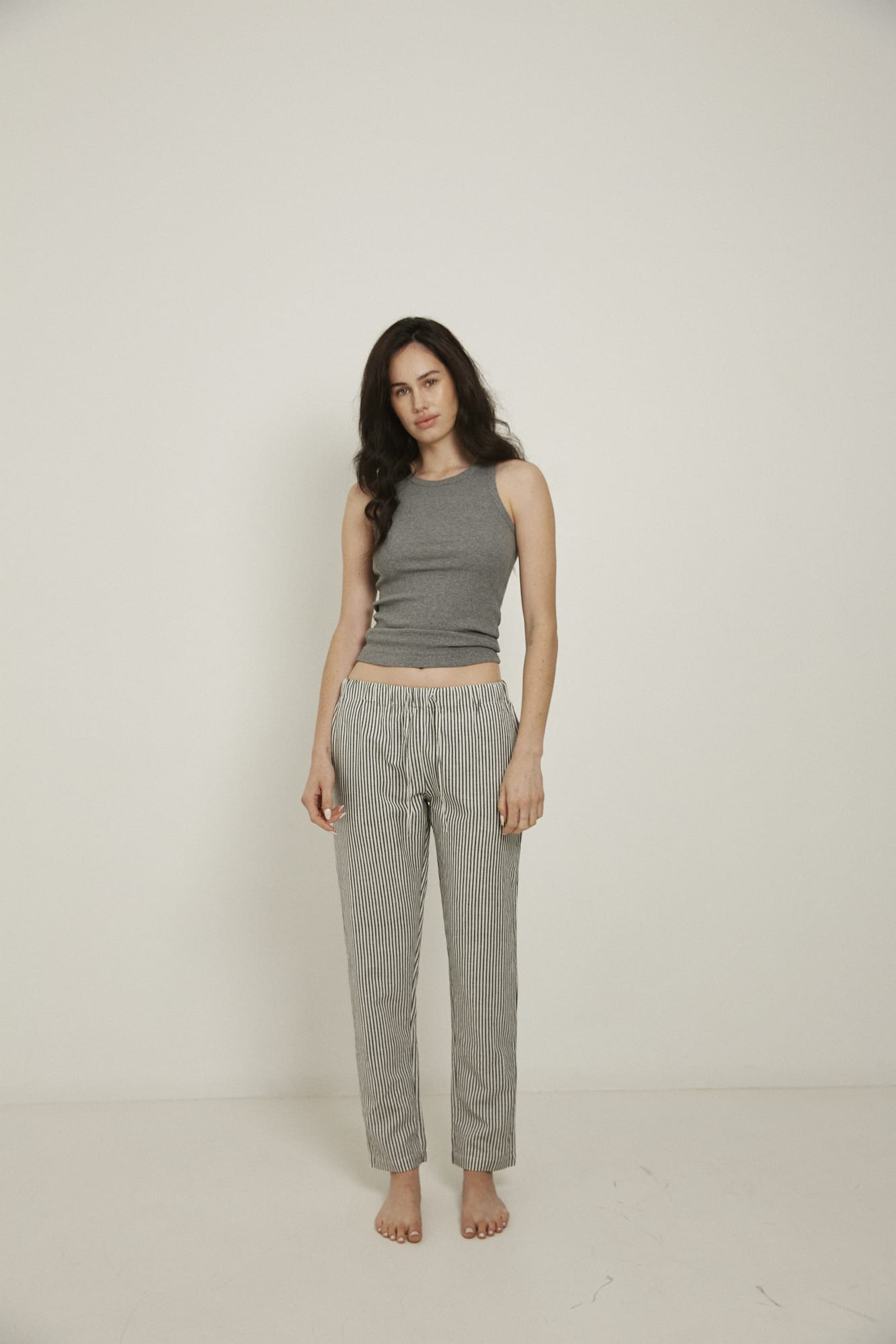 Women’s pyjama pant.  Made from an organic cotton and linen blend, in a black and white stripe.  These pants feature an elasticated waistband with a drawstring for comfort.
