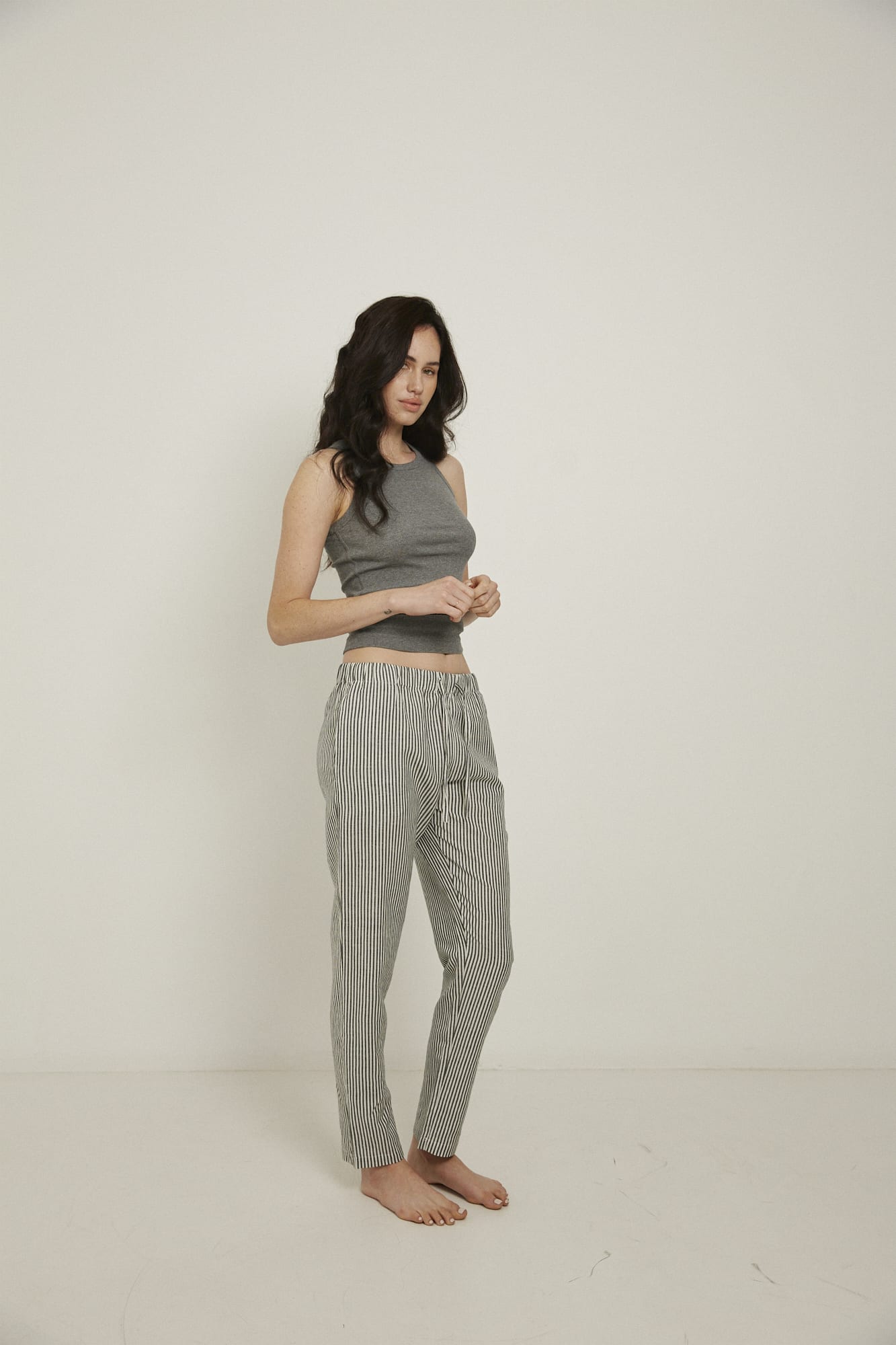 Women’s pyjama pant.  Made from an organic cotton and linen blend, in a black and white stripe.  These pants feature an elasticated waistband with a drawstring for comfort.