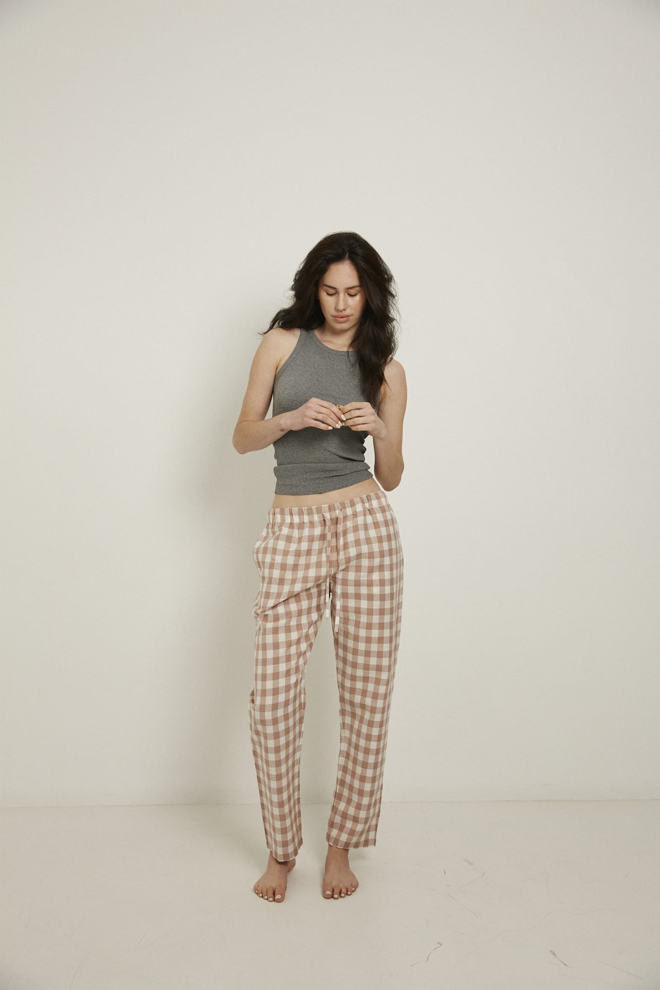 Women’s pyjama pant.  Made from an organic cotton and linen blend, in a pink and white check.  These pants feature an elasticated waistband with a drawstring for comfort.
