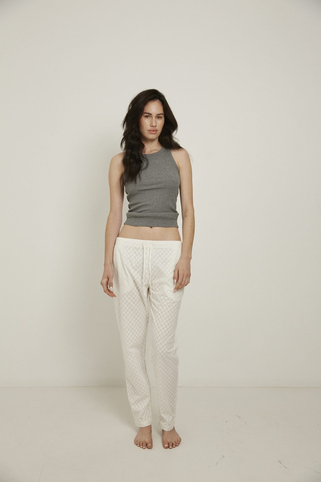 Women’s pyjama pant.  Made from 100% organic cotton, in white colour featuring delicate all over embroidery. These pants feature an elasticated waistband with a drawstring for comfort.